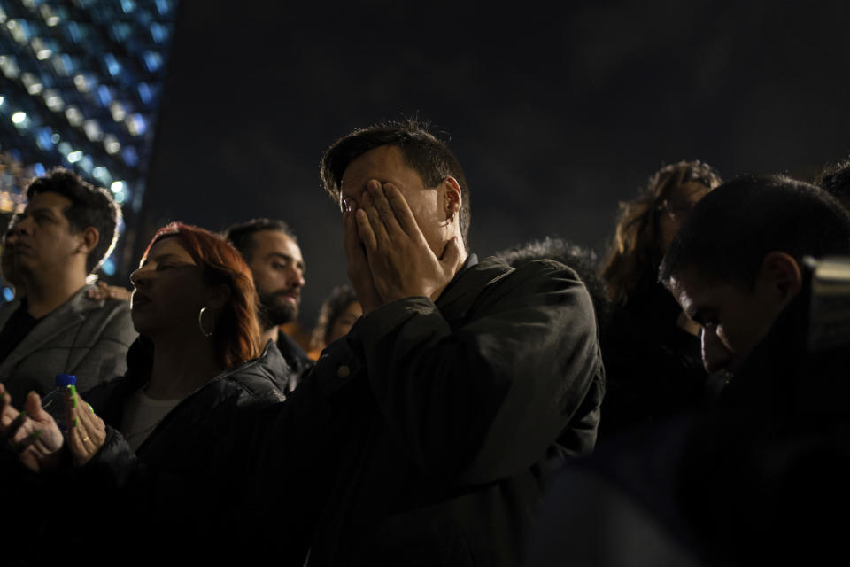 News anchor Guillermo Barraza covers his face in grief during a protest seeking justice over the death of magistrate Ociel Baena, the first openly nonbinary person in Latin America to hold a judicial position, in Mexico City, Monday, Nov. 13, 2023. Baena’s violent death sent shockwaves through Mexico’s gay community, that once looked to Baena as a vocal leader in their fight for visibility. (AP Photo/Aurea Del Rosario)