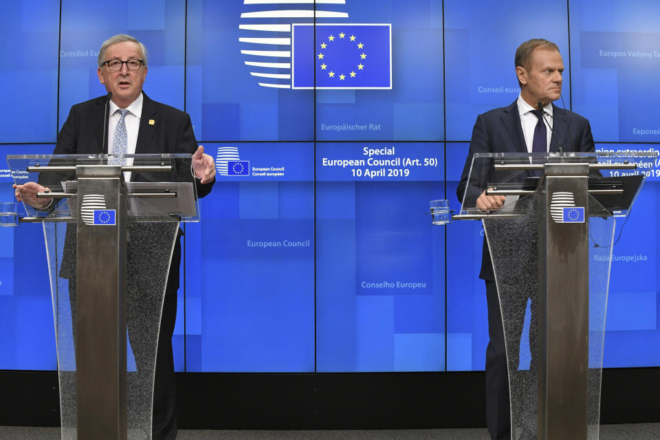 European Council President Donald Tusk, right, and European Commission President Jean-Claude Juncker, left, participate in a media conference at the conclusion of an EU summit in Brussels, Thursday, April 11, 2019. European Union leaders on Thursday offered Britain an extension to Brexit that would allow the country to delay its EU departure date until Oct. 31. (AP Photo/Riccardo Pareggiani)