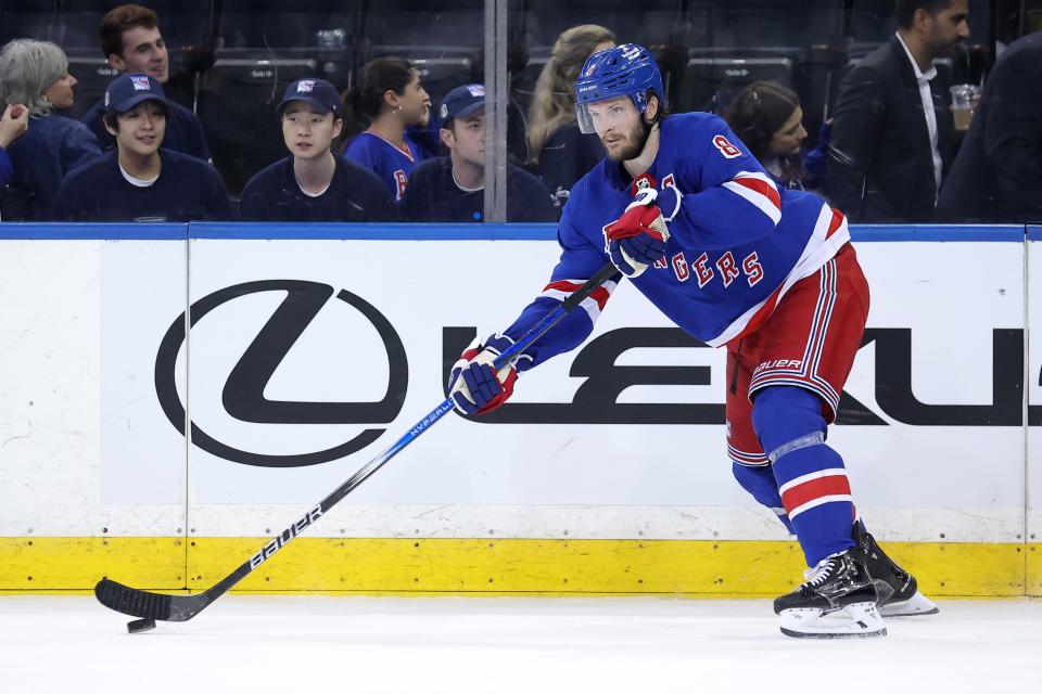 May 22, 2024; New York, New York, USA; New York Rangers defenseman Jacob Trouba (8) controls the puck against the Florida Panthers during the third period of game one of the Eastern Conference Final of the 2024 Stanley Cup Playoffs at Madison Square Garden.