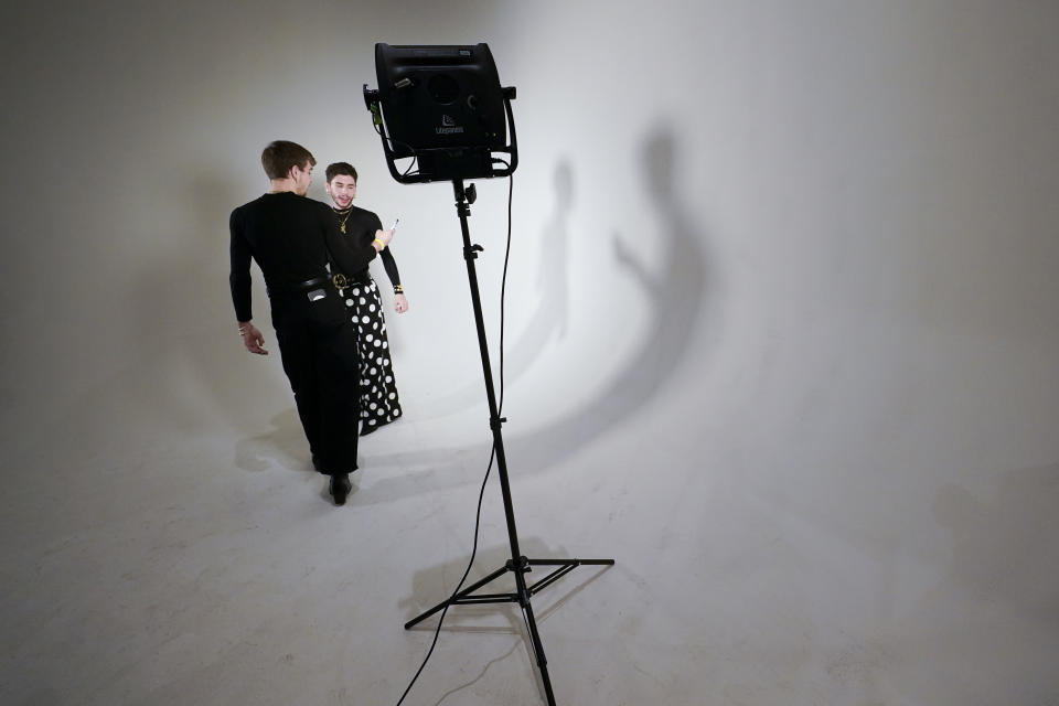 Members of the show crew work backstage before the presentation of the Sergio Hudson collection during Fashion Week, Saturday, Feb. 11, 2023, in New York. (AP Photo/Mary Altaffer)