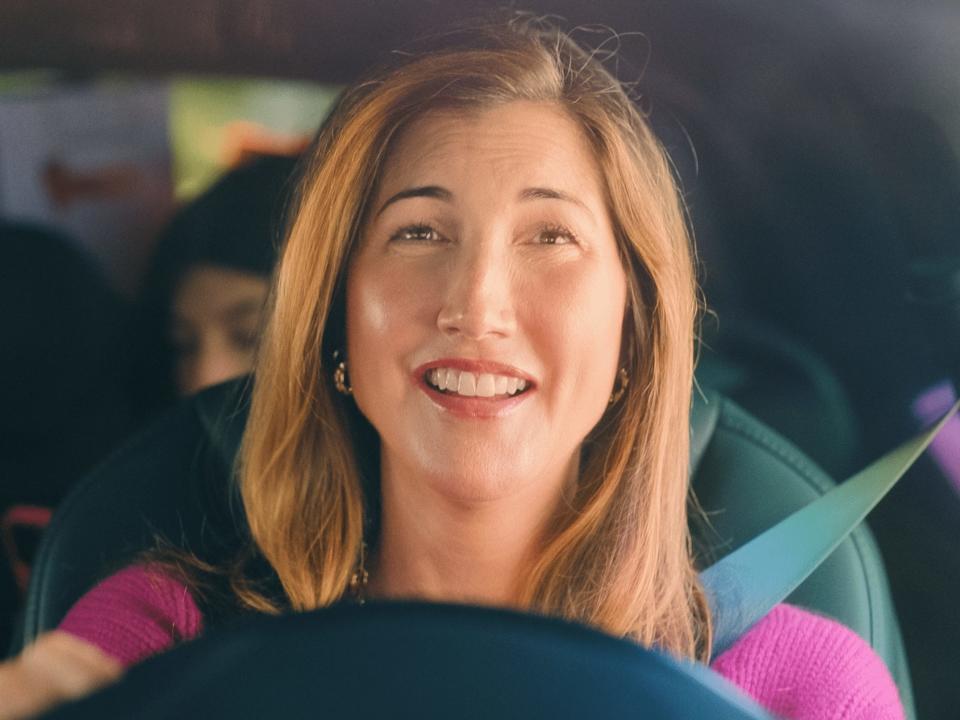 jackie sandler in you are so not invited to my bat mitzvah, smiling behind the wheel of a car