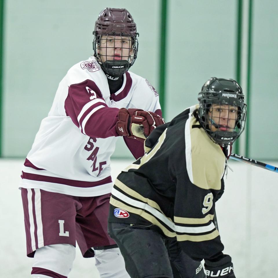 Jake Titone (left) and the La Salle defense has picked up its play this month and Friday kept Jake Rodger (right) and North Kingstown off the scoreboard in a 9-0 win.