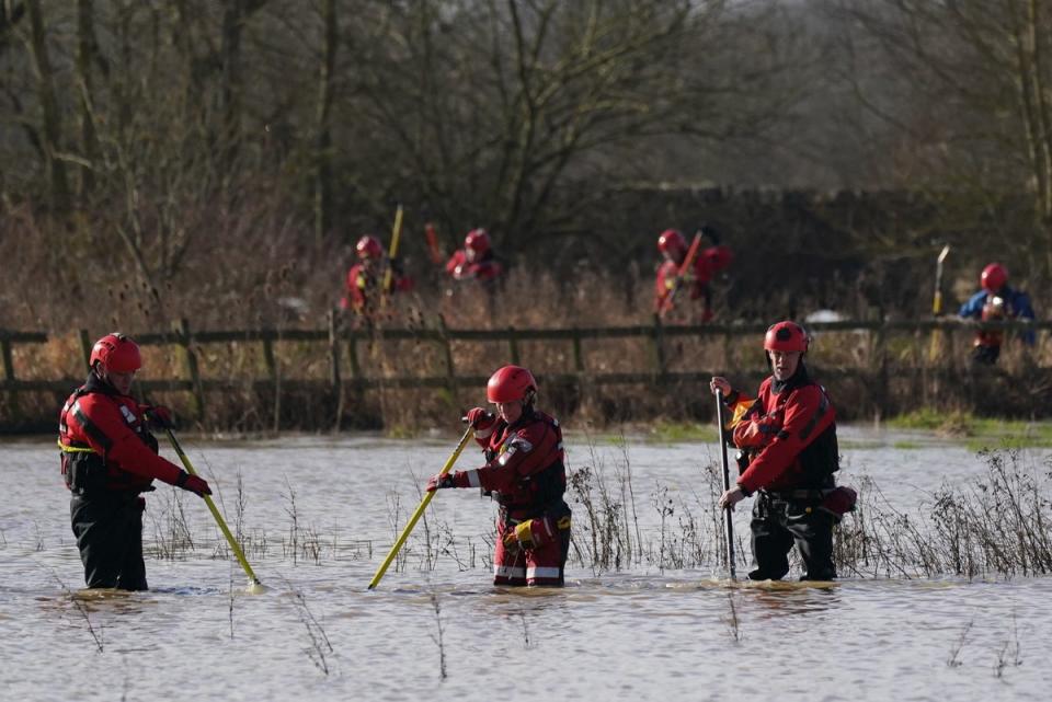 Rescue workers search marshland by the River Soar (PA)