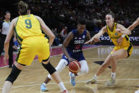 Serbia's Yvonne Anderson, centre, attempts to pass Australia's Bec Allen, left, and Steph Talbot during their game at the women's Basketball World Cup in Sydney, Australia, Sunday, Sept. 25, 2022. (AP Photo/Mark Baker)