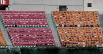 Spectators' seats are covered with pictures of fans before the start of a regular season baseball game between Hanwha Eagles and SK Wyverns in Incheon, South Korea, Tuesday, May 5, 2020. South Korea's professional baseball league start its new season on May 5, initially without fans, following a postponement over the coronavirus. (AP Photo/Lee Jin-man)