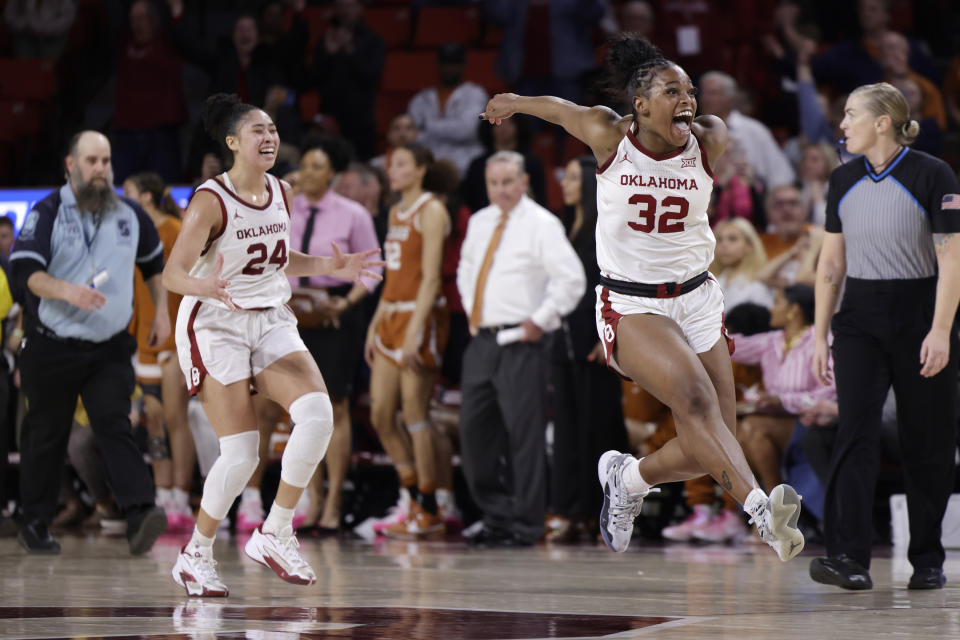 Oklahoma forward Skylar Vann (24) and forward Sahara Williams (32) react after beating Texas during an NCAA college basketball game Wednesday, Feb. 28, 2024, in Norman, Okla. (AP Photo/Garett Fisbeck)