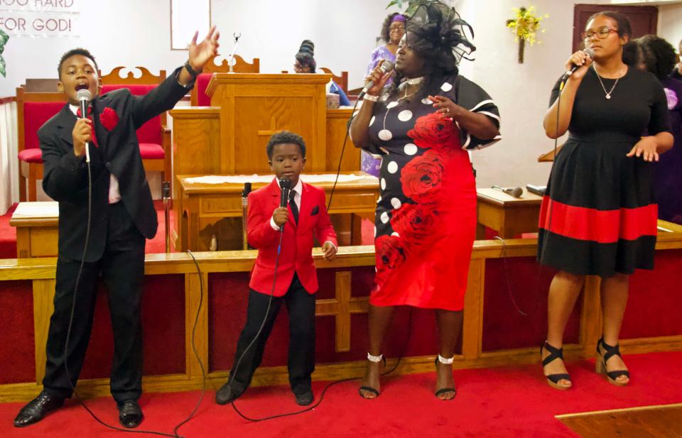 The Mount Olive Primitive Baptist Church Praise Team performs a selection in honor of Pastor Gwendolyn Williams’ second year as pastor at Pilgrim Rest Church of God In Unity in northeast Gainesville on Sunday.