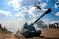 <p>A Msta-S self propelled artillery gun during the Open Water contest between pontoon bridge units at the 2018 International Army Games on the Oka River, Vladimir Region, Russia, Aug. 3, 2018. (Photo: Sergei Bobylev/TASS via Getty Images) </p>