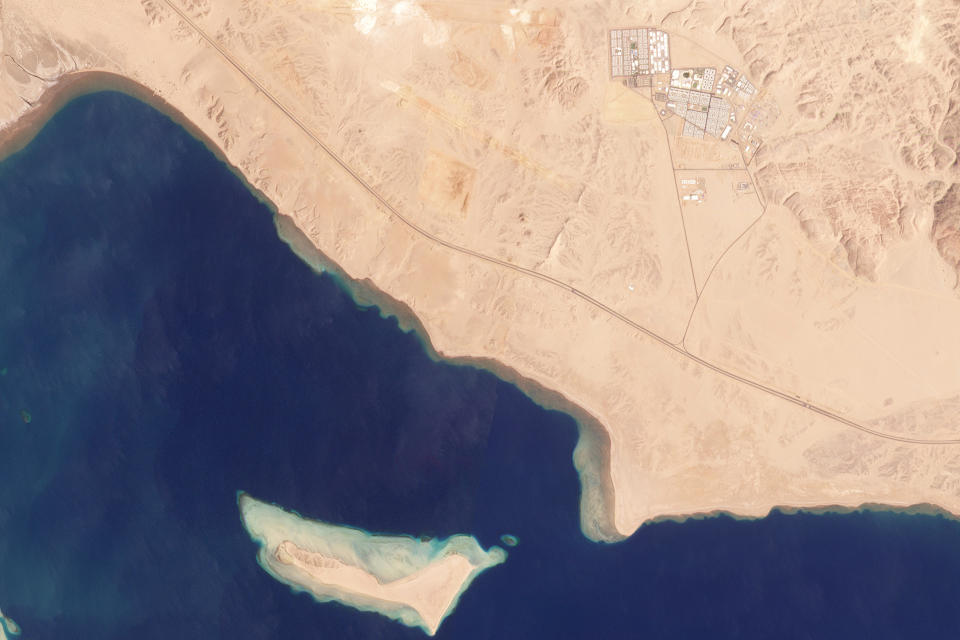 This satellite photo from Planet Labs PBC shows the empty desert around where the future city of Neom, Saudi Arabia, is planned March 25, 2022. The additional cash from higher energy prices amid Russia's war on Ukraine comes in handy for Crown Prince Mohammed bin Salman, whose vision for Saudi Arabia includes developing a futuristic city called Neom in the desert reaches along the Red Sea. Satellite photos from Planet Labs PBC show the wider Neom project remains still at an early stage. It likely will be years before they produce the jobs the prince counts on for slingshotting the kingdom's economy away from oil. (Planet Labs PBC via AP)