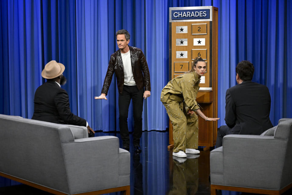 THE TONIGHT SHOW STARRING JIMMY FALLON -- Episode 1689 -- Pictured: (l-r) Tariq “Black Thought” Trotter, actor Neil Patrick Harris, actress Cara Delevingne, and host Jimmy Fallon play Charades on Wednesday, July 27, 2022 -- (Photo by: Todd Owyoung/NBC) - Credit: Todd Owyoung/NBC