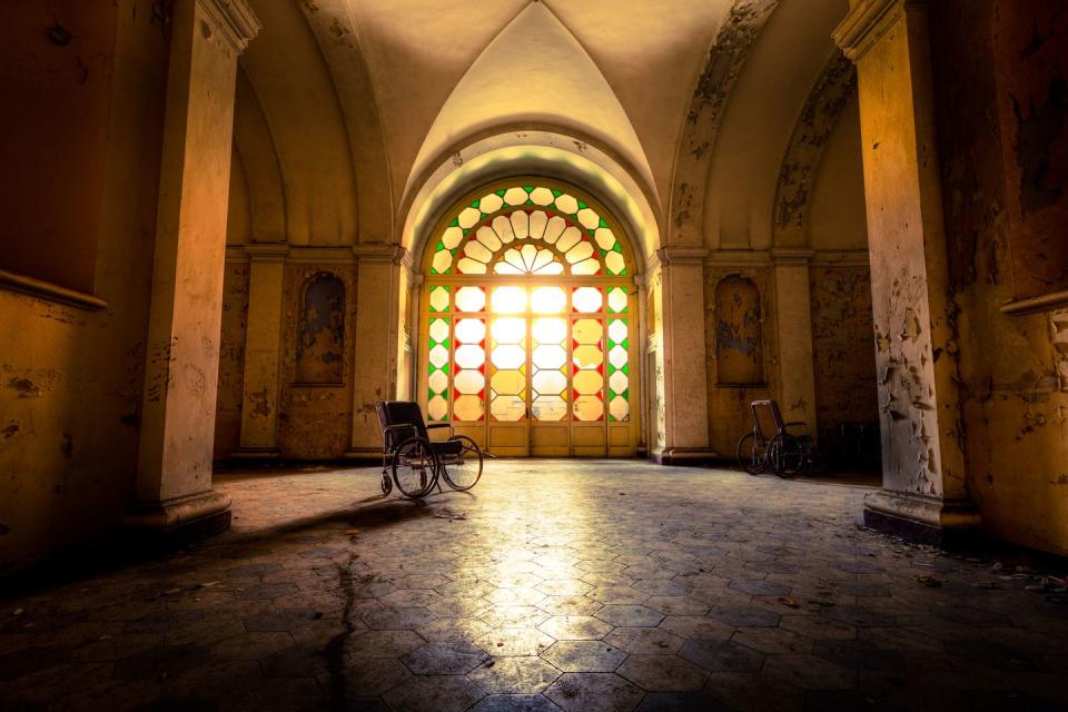 <p>Golden rays from the afternoon sun fill this empty hospital hall with a soft, warm glow.</p>