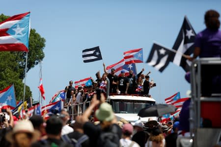 Puerto Rican celebrities including Residente, Bad Bunny and Ricky Martin join demonstrators during a protest calling for the resignation of Governor Ricardo Rossello in San Juan