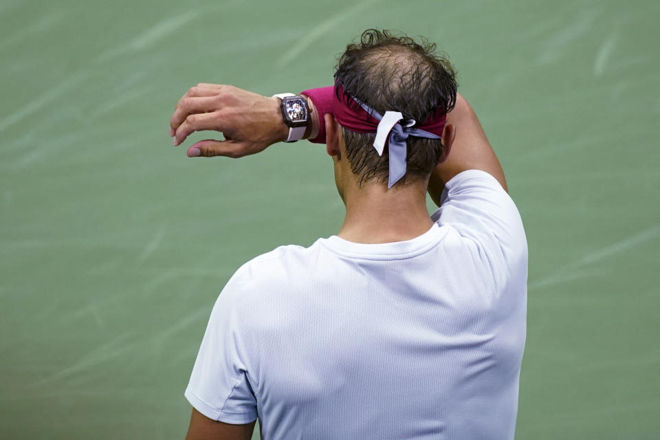 Rafael Nadal, of Spain, wipes his forehead during his match against Frances Tiafoe, of the United States, in the fourth round of the U.S. Open tennis championships, Monday, Sept. 5, 2022, in New York. (AP Photo/Eduardo Munoz Alvarez)