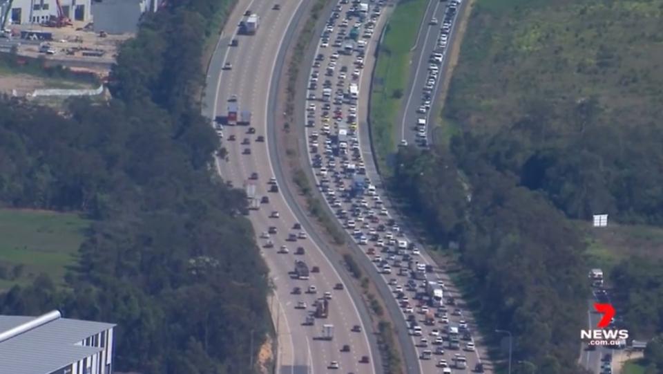 Police closed one lane of the M1, causing traffic to bank up in both directions stretching from Carrara to Ormeau — a distance of about 30km. Picture: 7 News