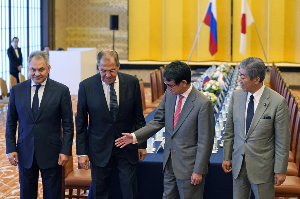 Japanese Foreign Minister Taro Kono, second from right, with Defense Minister Takeshi Iwaya, right, shows the way to Russian Foreign Minister Sergei Lavrov, second from left, and Defense Minister Sergei Shoigu prior to their meeting at the Iikura guest house in Tokyo Thursday, May 30, 2019. They hold meetings amid lack of progress on settling island disputes. (Franck Robichon/Pool Photo via AP)