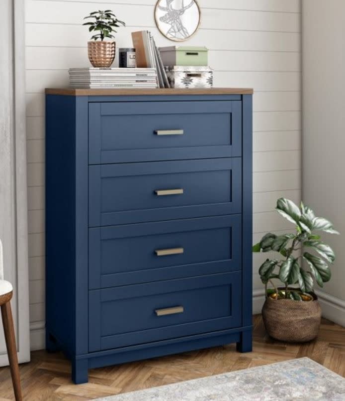 tall dark blue dresser with many drawers