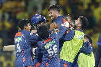 Lucknow Super Giants' team members lift Marcus Stoinis as they celebrate their win in the Indian Premier League cricket match between Chennai Super Kings and Lucknow Super Giants in Chennai, India, Tuesday, April 23, 2024. (AP Photo/R.Parthiban)