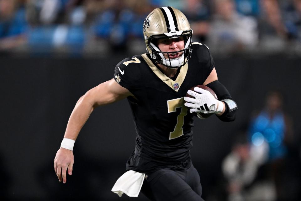 CHARLOTTE, NORTH CAROLINA - SEPTEMBER 18: Taysom Hill #7 of the New Orleans Saints runs with the ball against the Carolina Panthers during the first quarter in the game at Bank of America Stadium on September 18, 2023 in Charlotte, North Carolina. (Photo by Grant Halverson/Getty Images)