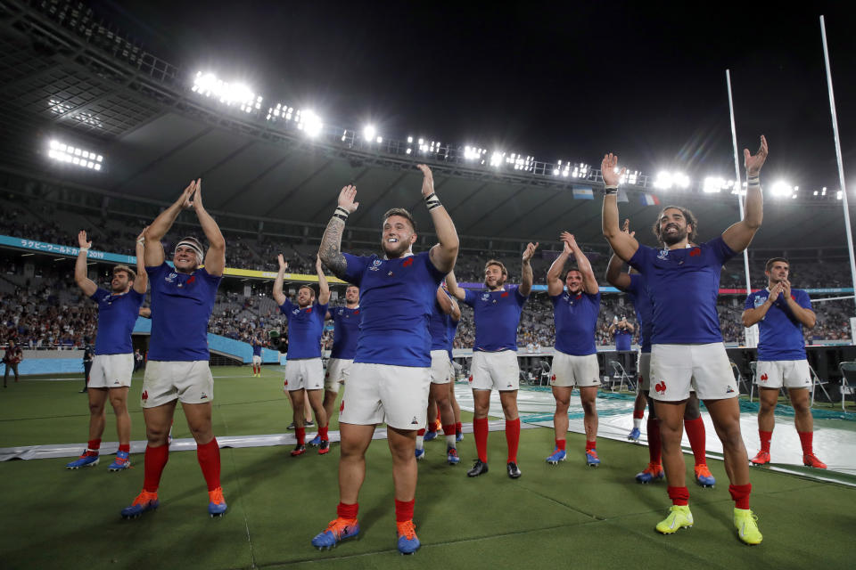 French rugby players celebrate after defeating Argentina during the Rugby World Cup Pool C game at Tokyo Stadium between France and Argentina in Tokyo, Japan, Saturday, Sept. 21, 2019. (AP Photo/Christophe Ena)