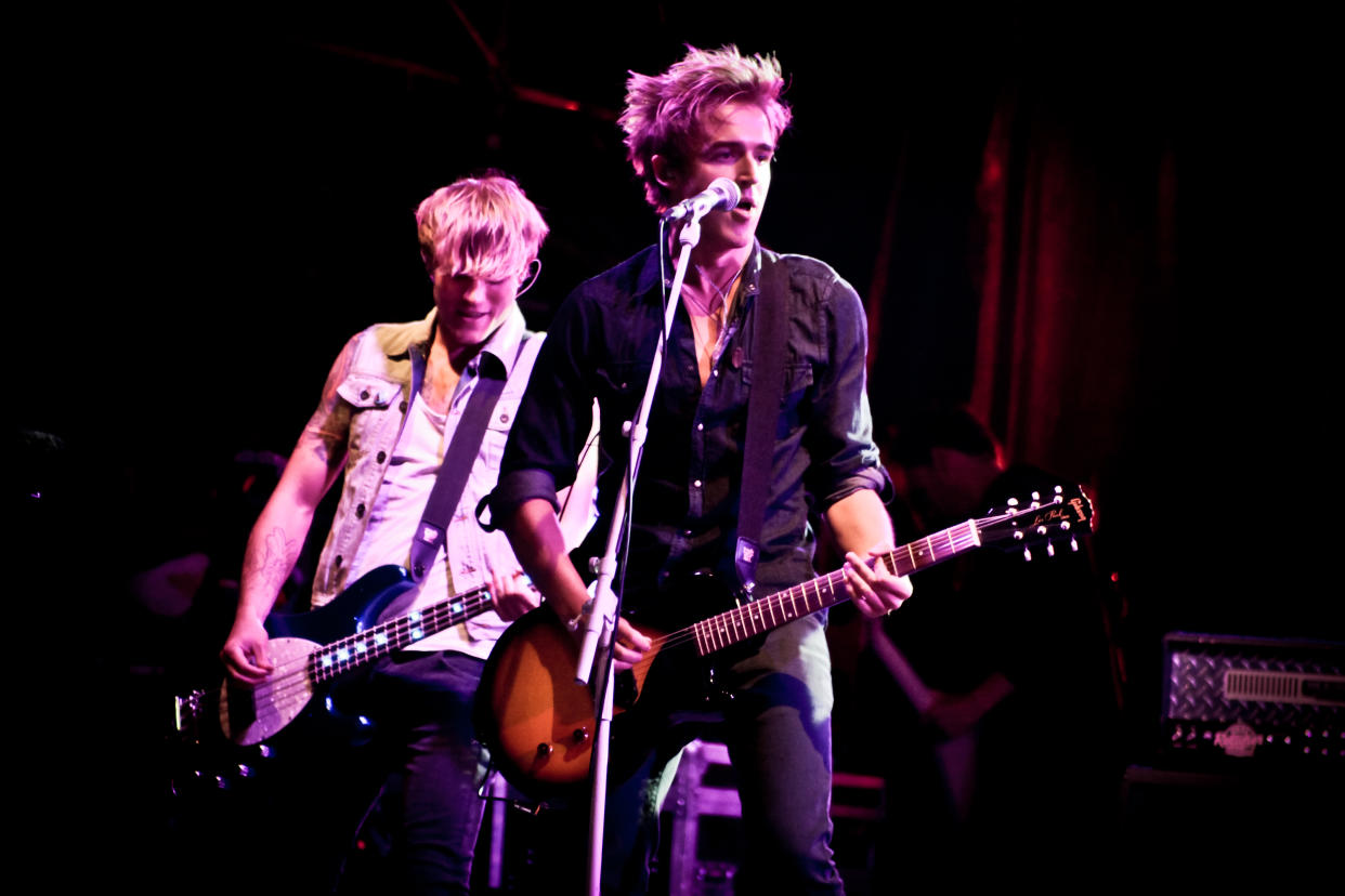 LONDON, UNITED KINGDOM - AUGUST 28: Dougie Poynter and Tom Fletcher of McFly perform on stage at Summer Live Music Fest at Sandown Race Course on August 28, 2010 in London, England. (Photo by Christie Goodwin/Getty Images)