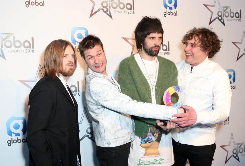 Chris Edwards, Tom Meighan, Serge Pizzorno and Ian Matthews of Kasabian, with the award for Best Indie in the press room at the Global Awards, a brand new awards show hosted by Global, the Media and Entertainment group, at London's Eventim Apollo Hammersmith. Picture date: Thursday March 1, 2018. See PA story SHOWBIZ Global. Photo credit should read: Isabel Infantes/PA Wire