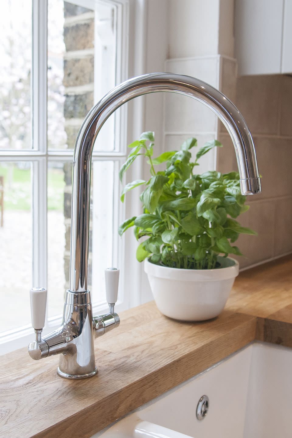 Install a hook above the kitchen sink.