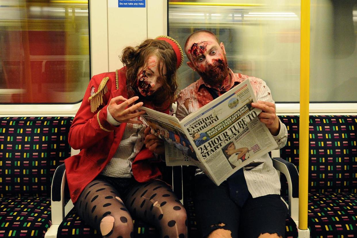 File Photo: Zombies read a copy of the Standard. Backyard Cinema had pop-up "Zombie Apocalypse" screenings in 2014: Stuart C. Wilson/Getty/Backyard Cinema