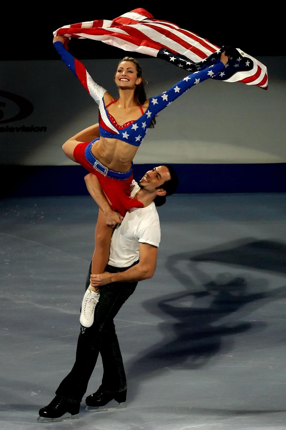 <p>American Tanith Belbin took patriotism to another level in her bedazzled USA inspired ice dancing dress. Her partner, Benjamin Agosto, was more understated in a white shirt and black pants. </p>