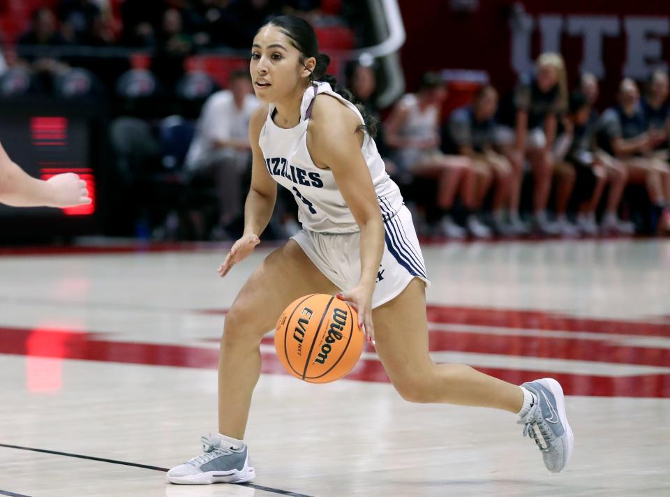 Copper Hills’ Alyssa Loza dribbles during a 6A girls quarterfinal basketball game against Mountain Ridge at the Huntsman Center in Salt Lake City on Monday, Feb. 26, 2024. Copper Hills won 49-31. | Kristin Murphy, Deseret News