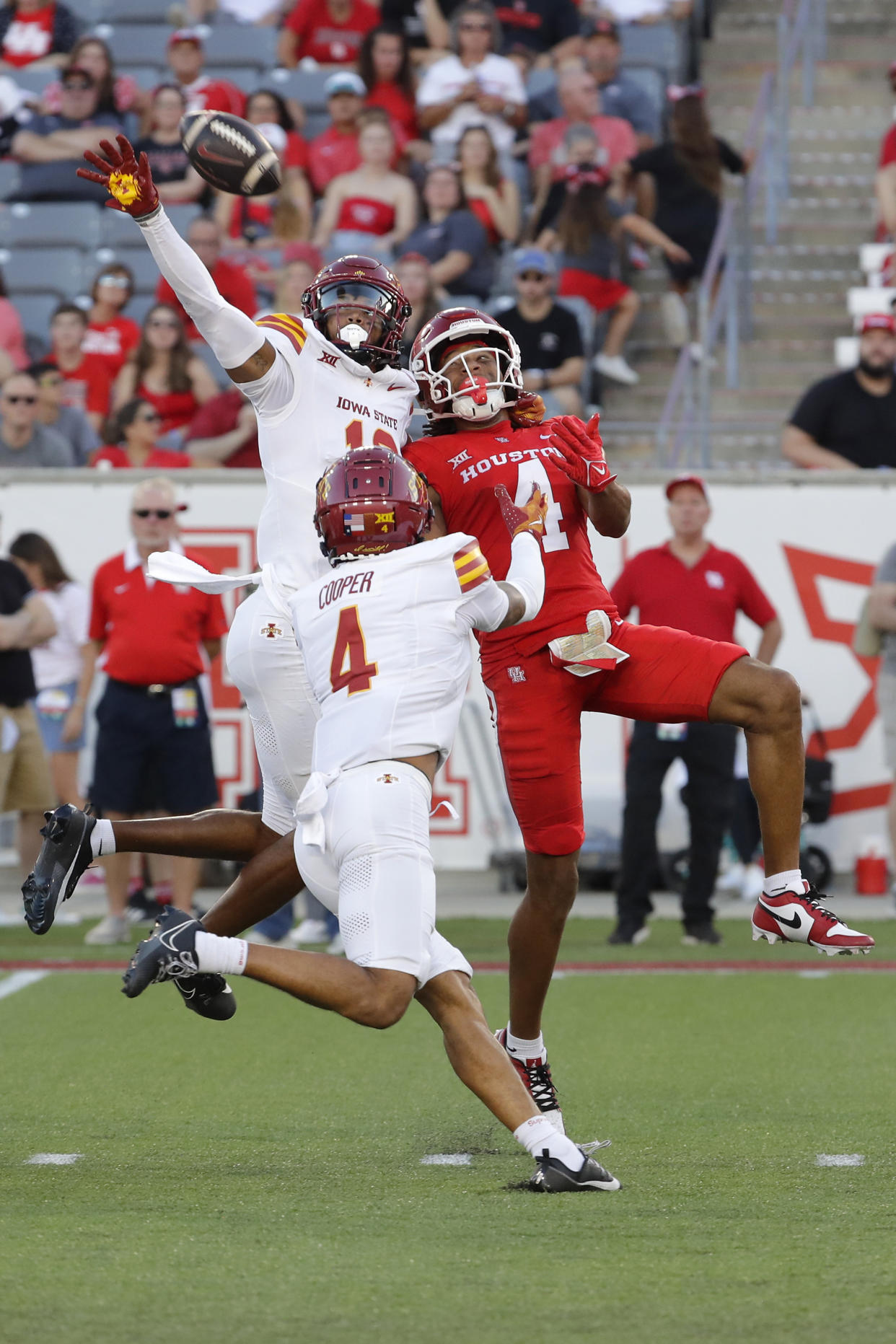 Iowa State defensive back Darien Porter, top left, knocks away the ball as he breaks up the reception intended for Houston wide receiver Jonah Wilson, right, as defensive back Jeremiah Cooper, bottom left, assists during the first half of an NCAA college football gam,e Saturday, Sept. 28, 2024, in Houston. (AP Photo/Michael Wyke)