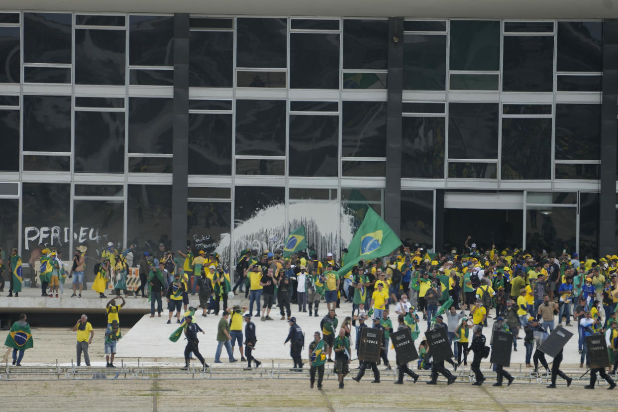 Protesters, supporters of Brazil's former President Jair Bolsonaro, storm the Supreme Court building in Brasilia, Brazil, Sunday, Jan. 8, 2023. (Eraldo Peres/AP)