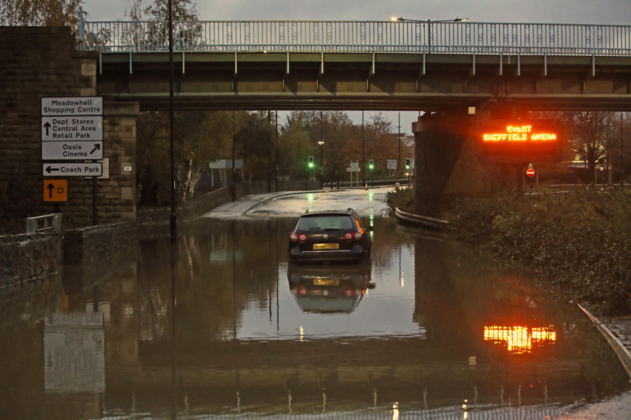 A car sits in floodwater near Meadowhall shopping centre in Sheffield where some people were forced to stay overnight after heavy rain and flooding caused local roads to become gridlocked. (Photo by Danny Lawson/PA Images via Getty Images)