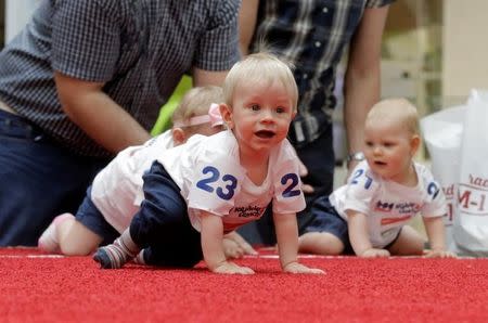 Babies take part in the Baby Race to mark international Children's Day in Vilnius, Lithuania, June 1, 2016. REUTERS/Ints Kalnins