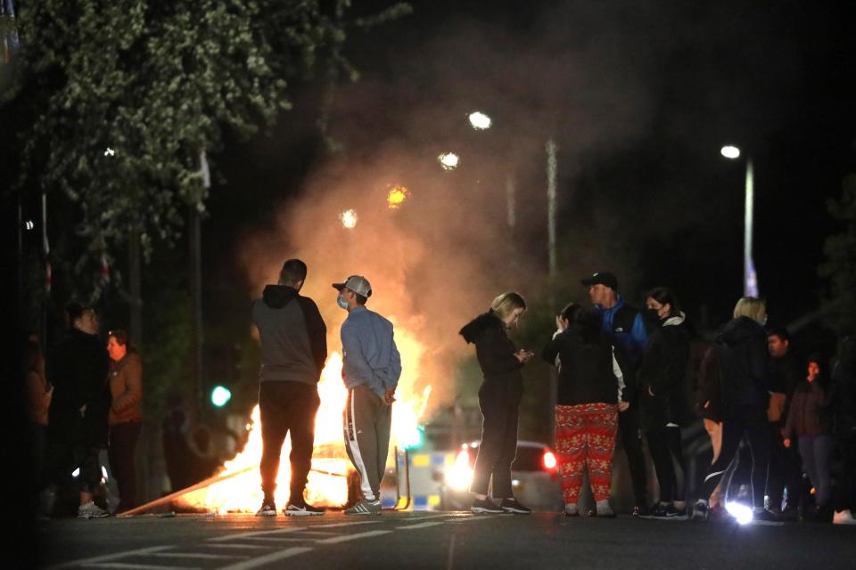 Loyalists block a road during disturbances in North Belfast on FridayAP