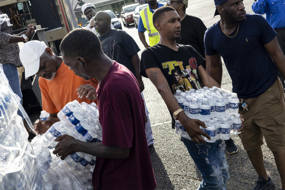 Cases of bottled water are handed out at a Mississippi Rapid Response Coalition distribution site on Aug. 31. 