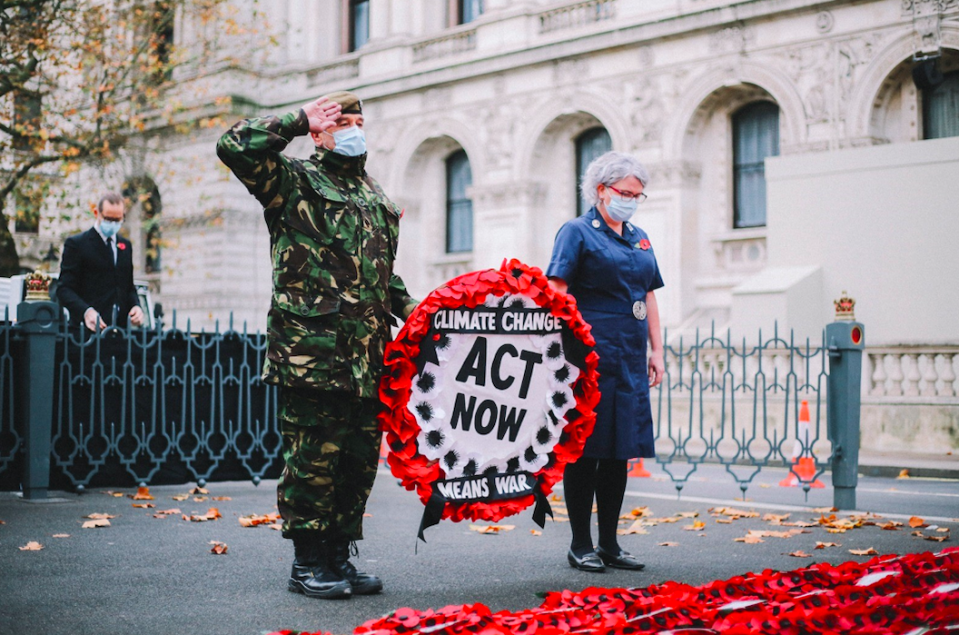 Donald Bell saluted the Cenotaph before laying the climate change wreath. (PA)