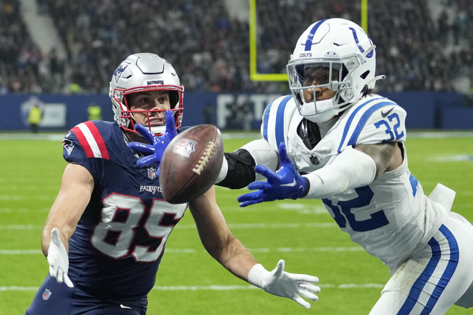 Indianapolis Colts safety Julian Blackmon (32) tries in vain to intercept a pass in the end zone that was intended for New England Patriots tight end Hunter Henry (85) in the second half of an NFL football game in Frankfurt, Germany Sunday, Nov. 12, 2023. (AP Photo/Martin Meissner)