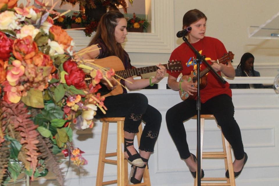 Cousins Aliea Williams, right, and Rachel Thounsand, left, performed during the service.