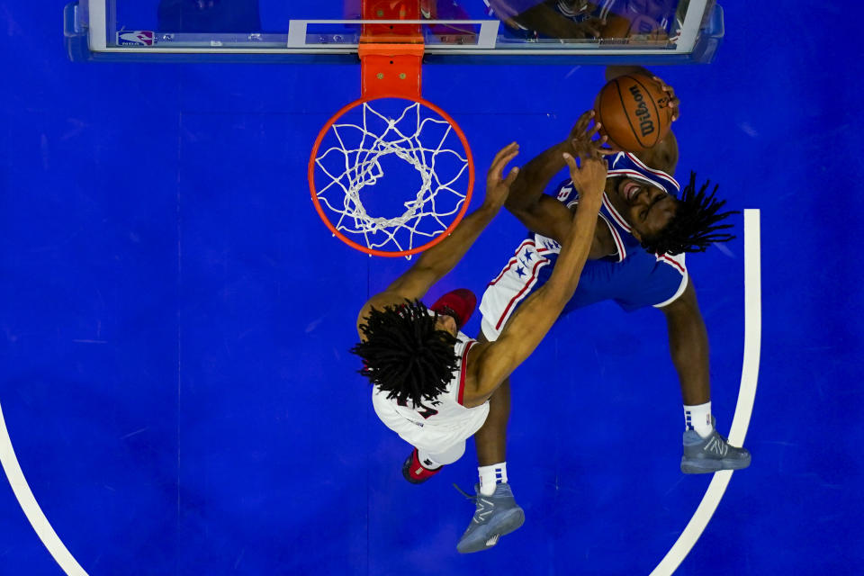 Philadelphia 76ers' Tyrese Maxey, right, shoots against Portland Trail Blazers' Shaedon Sharpe, left, during the first half of an NBA basketball game, Sunday, Oct. 29, 2023, in Philadelphia. (AP Photo/Chris Szagola)