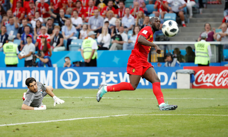 <p>Cool as you like: Manchester United striker Romelu Lukaku rounds off a sweeping Belgium move for number three. (REUTERS/Francois Lenoir) </p>