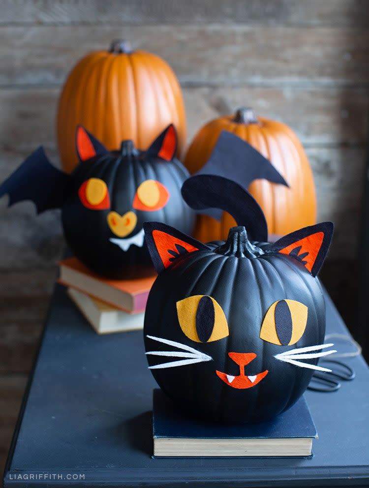 <p>Family members of all ages can assemble felt-tastic Halloween faces on top of faux black pumpkins.</p><p><strong>Get the tutorial at <a href="https://go.redirectingat.com?id=74968X1596630&url=https%3A%2F%2Fliagriffith.com%2Fkids-felt-pumpkin-decorations%2F&sref=https%3A%2F%2Fwww.countryliving.com%2Fdiy-crafts%2Fg28437255%2Fpumpkin-faces-ideas%2F" rel="nofollow noopener" target="_blank" data-ylk="slk:Lia Griffith;elm:context_link;itc:0;sec:content-canvas" class="link ">Lia Griffith</a>.</strong> </p>