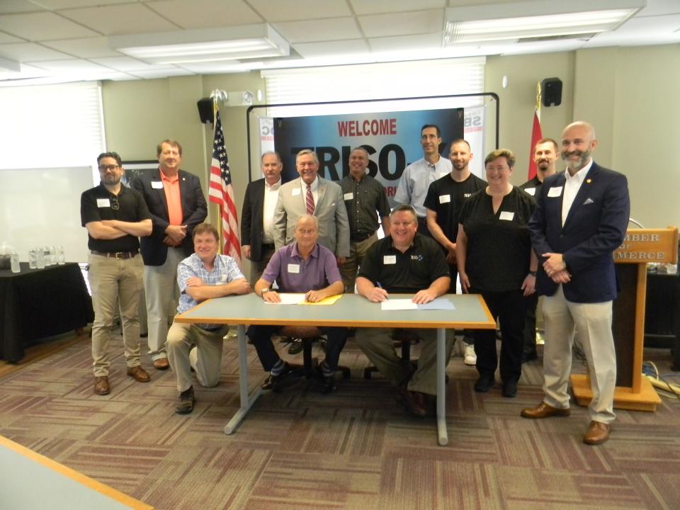 Various public officials showed up for the signing event for nuclear fuel company TRISO-X. Pictured are, front row, Gary Bell, TRISO-X, from left, David Wilson, IDB chairman, Pete Pappano, president of TRISO-X; Jennifer Wheeler, TRISO-X, and Oak Ridge City Council member Jim Dodson. In the back row are J.R. Hertwig, IDB, Mark Watson, Oak Ridge city manager, Jack Suggs, deputy city manager, Tennessee Rep. John Ragan, R-Oak Ridge, Joel McDuffee, Ron Cacheiro, Dan Brown, and Brandon Blamer, all of TRISO-X.