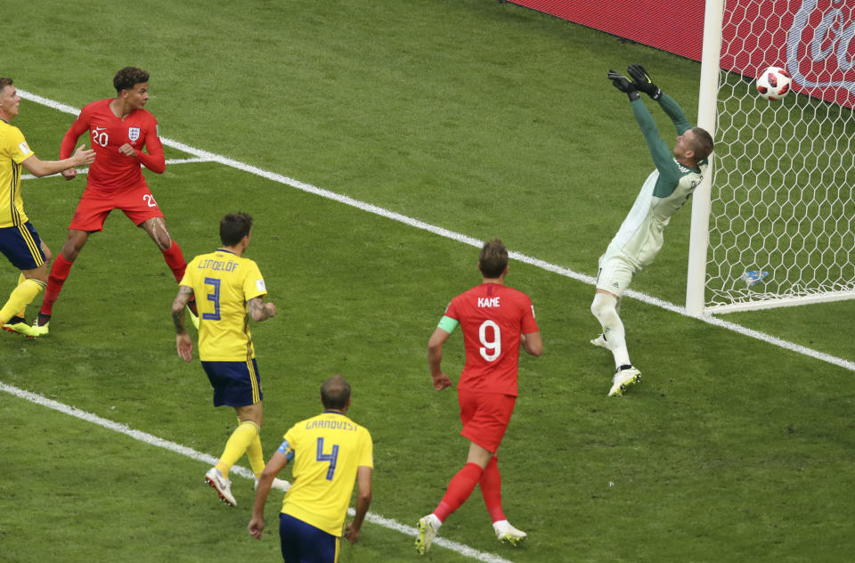 Dele Alli heads home England’s second goal, as they reached the last four of the World Cup with victory over Sweden