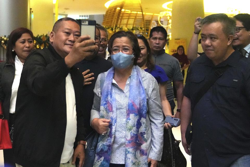 Former senator Leila de Lima, center, poses for a picture on her way to a press conference in Quezon City, Philippines Monday Nov. 13, 2023. A Philippine court on Monday ordered the temporary release on bail of the country's most popular prisoner, who was jailed as a senator more than six years ago on drug charges she said were fabricated to muzzle her investigation of then-President Rodrigo Duterte's brutal anti-drugs crackdown. (AP Photo/Aaron Favila)