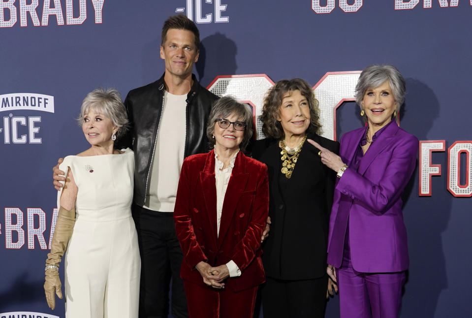 From left, Rita Moreno, Tom Brady, Sally Field, Lily Tomlin and Jane Fonda, cast members in "80 for Brady," pose together at the premiere of the film, Tuesday, Jan. 31, 2023, at the Regency Village Theatre in Los Angeles. (AP Photo/Chris Pizzello)