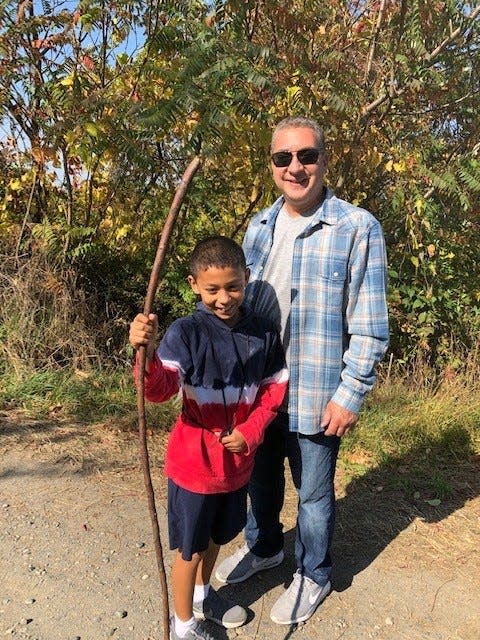 11-year-old Derek Rosaly with his late father, Jay Rosaly.