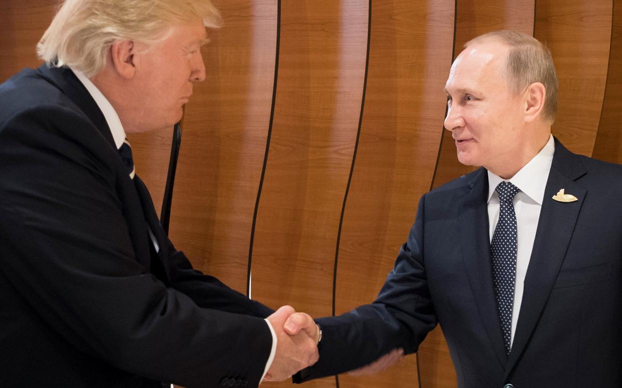 US President Donald Trump  shaking hands with Russian President Vladimir Putin  - Steffen Kugler/EPA