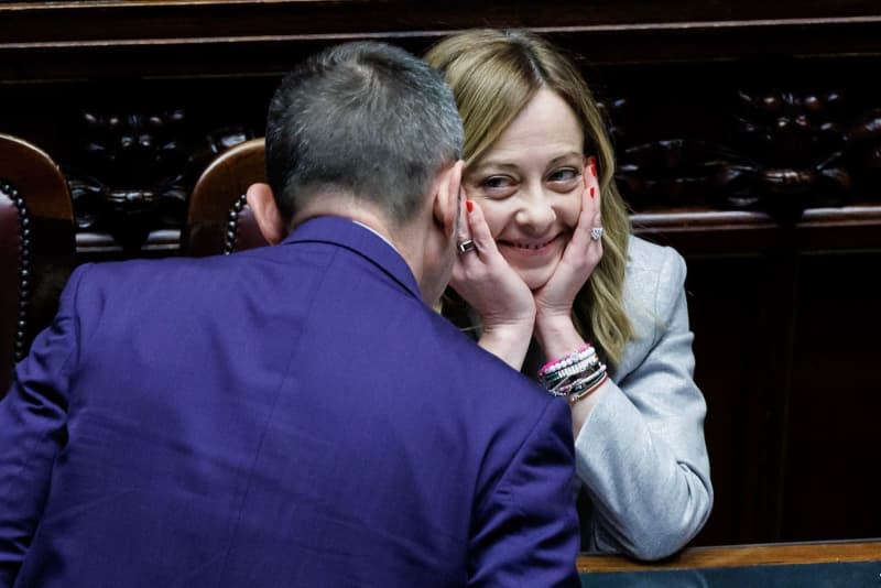 Italian Prime Minister Giorgia Meloni speaks with Andrea Delmastro Delle Vedove during a plenary session at the Italian Chamber of Deputies. Roberto Monaldo/LaPresse via ZUMA Press/dpa