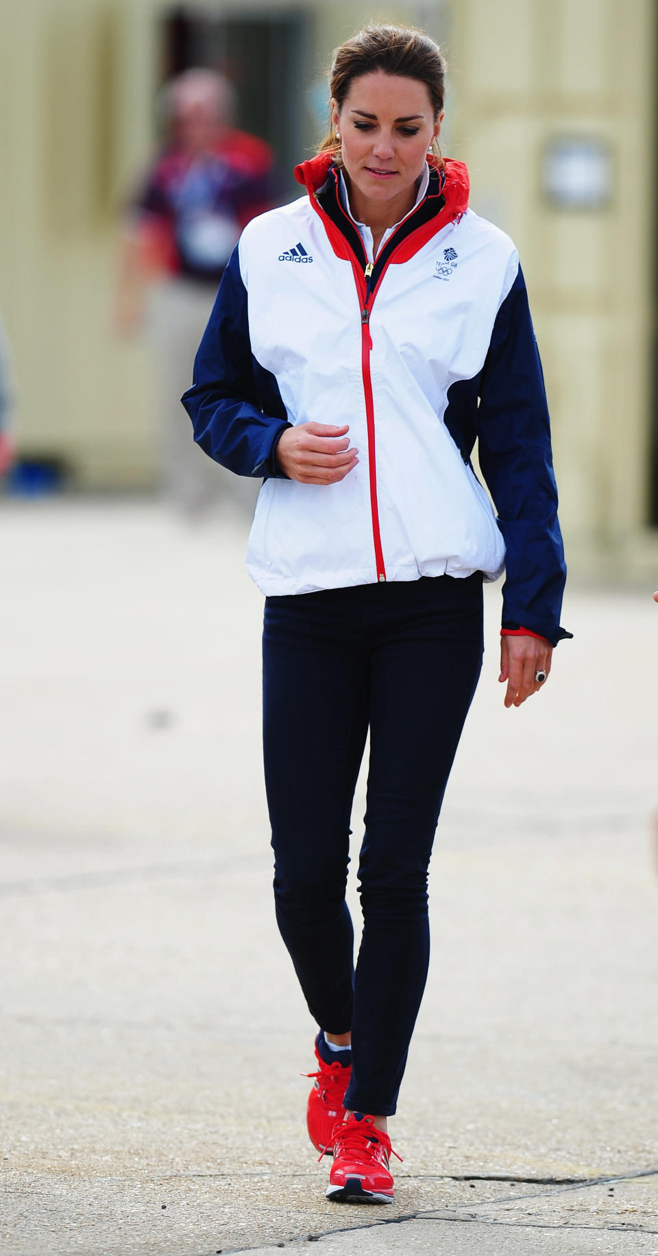 We love the contrast of Kate's over-sized sports jacket with skinny jeans. Her bright red tennis shoes really tie the outfit all together. <br>--<br> Catherine, Duchess of Cambridge walks in the boat park on Day 10 of the London 2012 Olympic Games at the Weymouth & Portland Venue at Weymouth Harbour on August 6, 2012 in Weymouth, England.