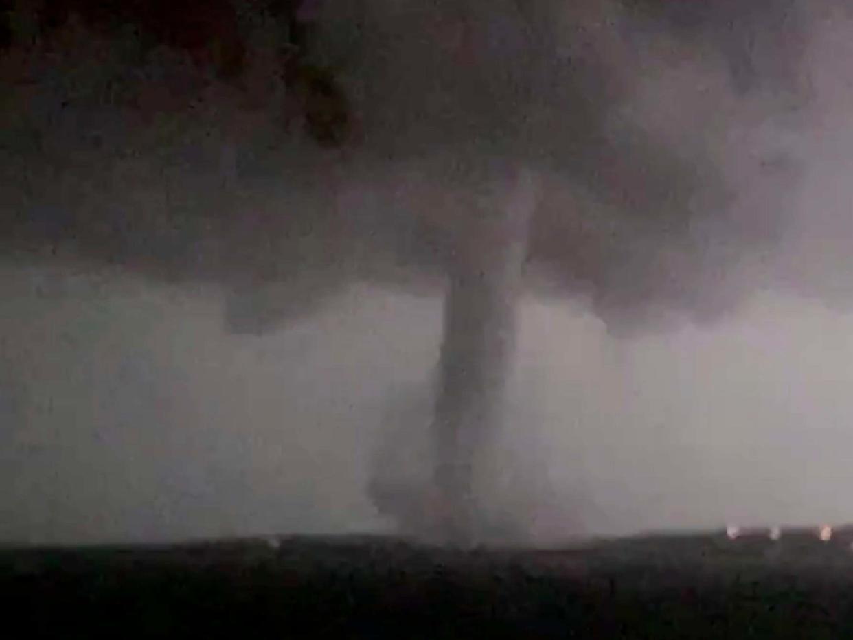 This 20 October 2019 image made from video by Twitter user @AthenaRising shows the tornado in Rockwall, Texas. The National Weather Service confirmed a tornado touched down in Dallas on Sunday night, causing structural damage and knocking out electricity to thousands. (@AthenaRising via AP): AP